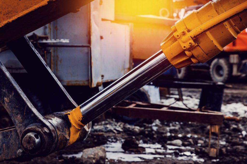 hydraulic cylinder on an earthmoving machine excavator that may have dieseling which can damage hydraulic seals and piston so you need to contact A1 hydraulic engineering to reseal, reman, remanufacture, manufacture hydraulic cylinders